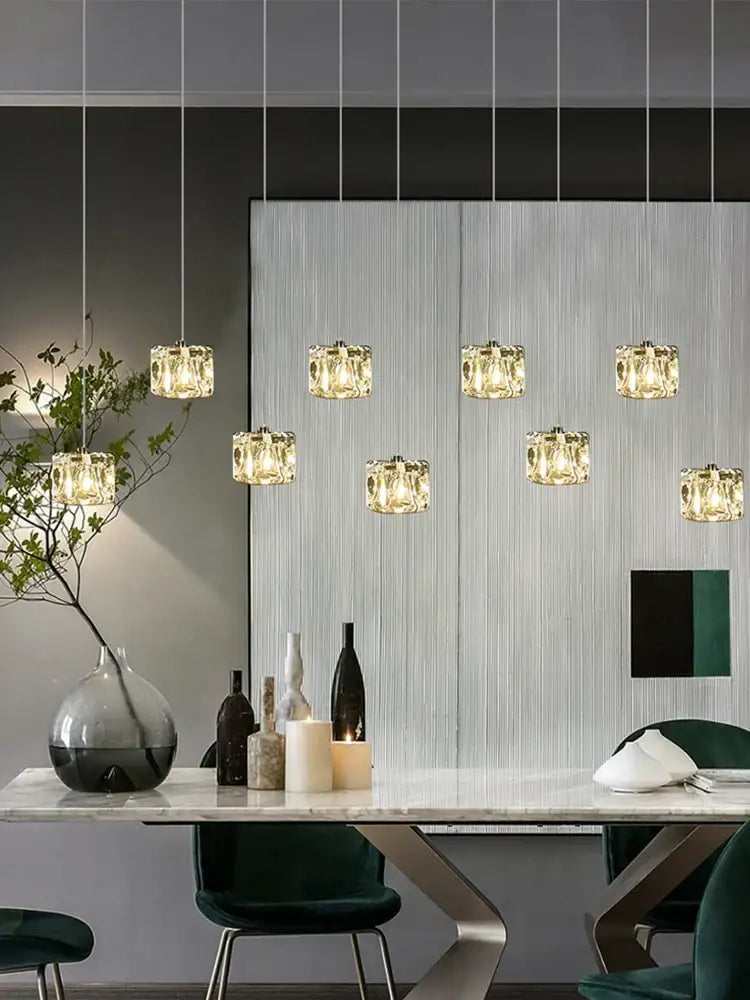 A modern DecorBites crystal chandelier pendant light featuring warm glowing crystal pendants for indoor dining lighting