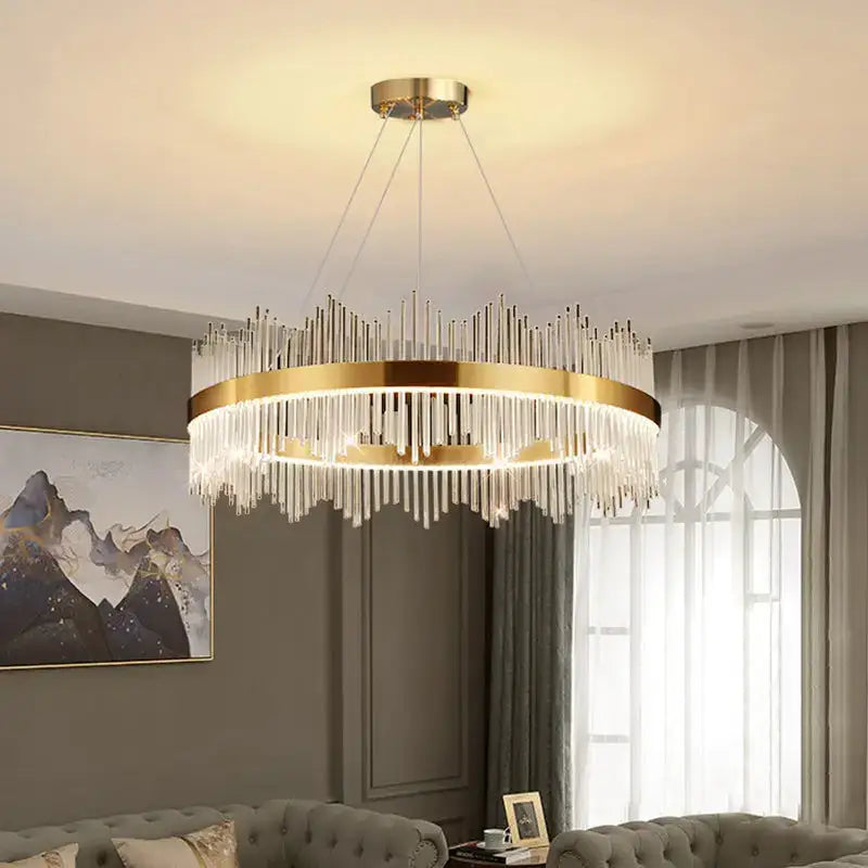 A modern gold-toned decorbites crystal chandelier pendant light with cascading glass rods for dining room luxury