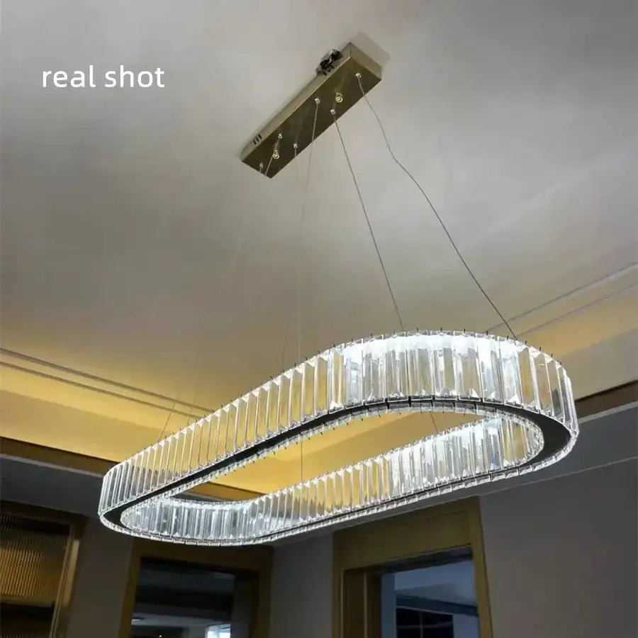 Modern decorbites crystal chandelier pendant lights with clear faceted crystal prisms and a sleek metallic frame