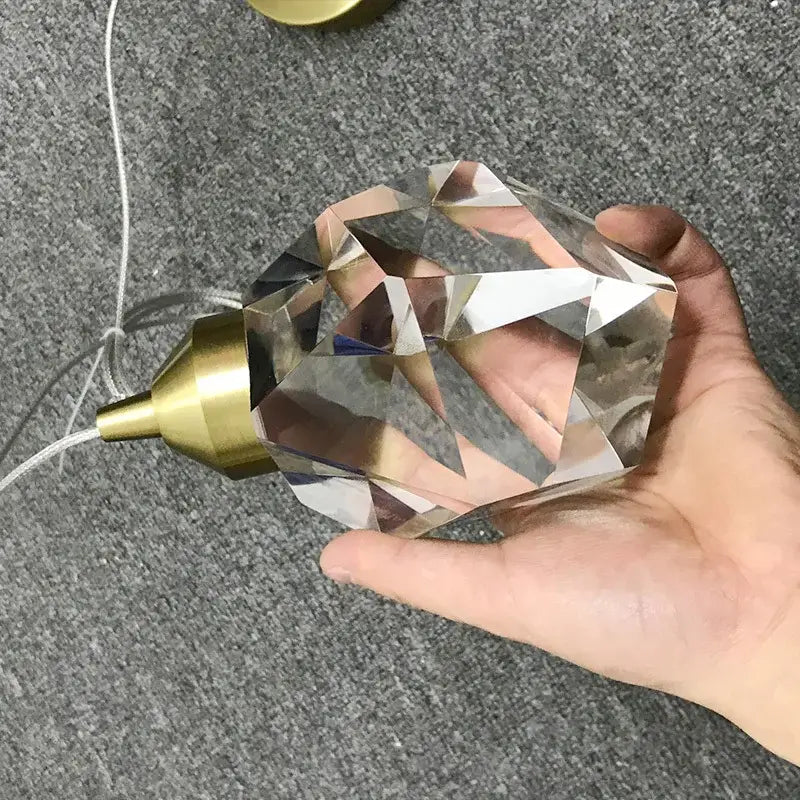 A clear faceted crystal chandelier pendant with a brass metal cap and cord for decorbites crystal chandelier lights
