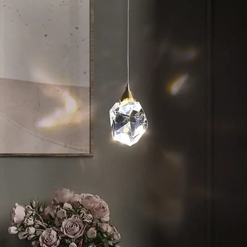 DecorBites crystal chandelier pendant light features a faceted crystal design with gold-toned metal top for dining room