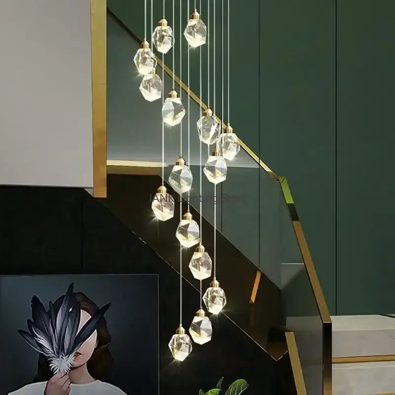 A modern decorbites crystal chandelier pendant with faceted clear glass crystal pendant lights and gold fixtures