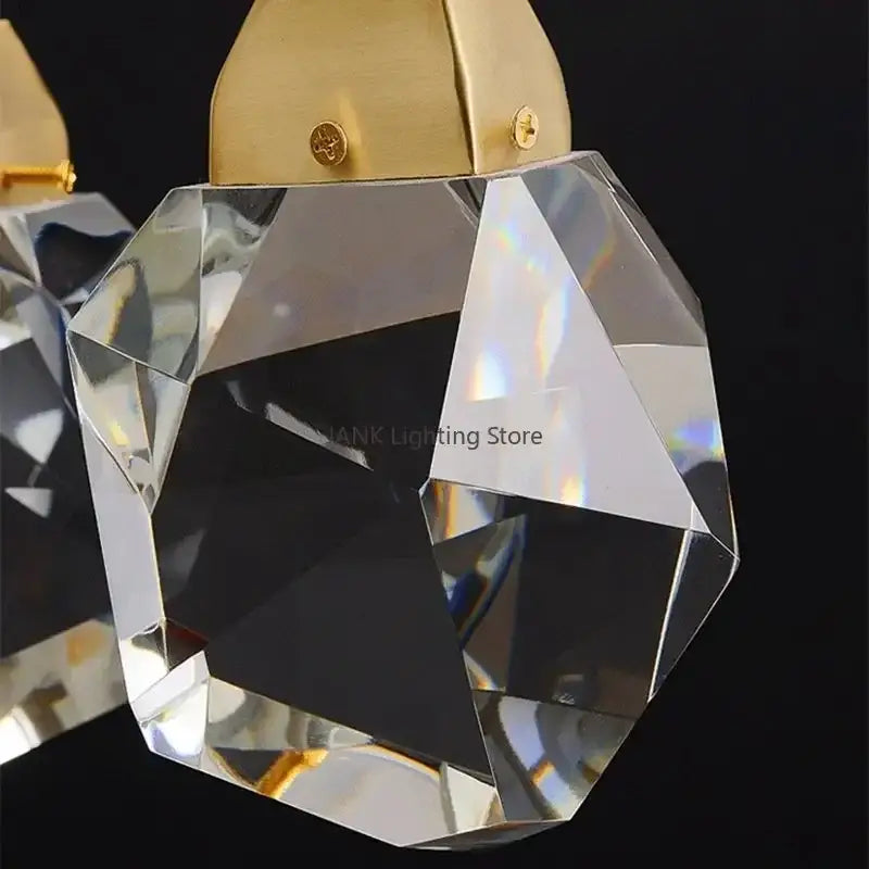 A faceted crystal chandelier pendant with a gold-toned metal top from decorbites crystal pendant lights