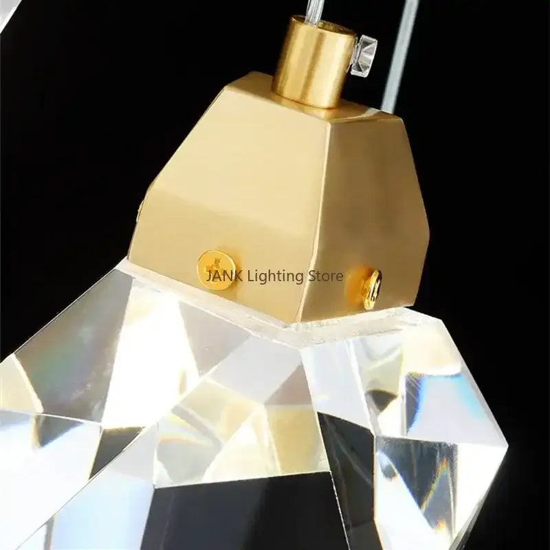 Gold-toned metal decorbites crystal chandelier pendant light with faceted crystal pendant for elegant home decor