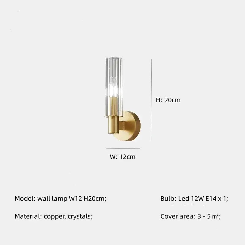 A sleek brass pendant light with a clear crystal glass cylinder housing an led bulb from decorbites crystal chandelier collection