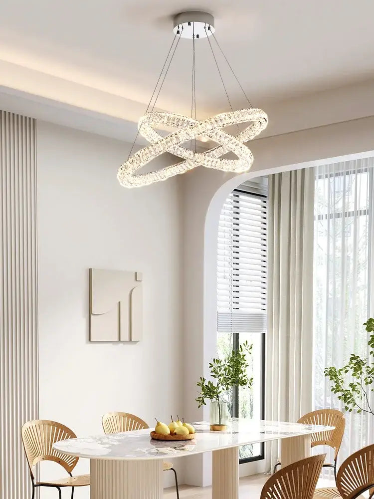 Modern decorbites crystal chandelier ring with interlocking glass rings and sleek metallic finish for elegant living spaces