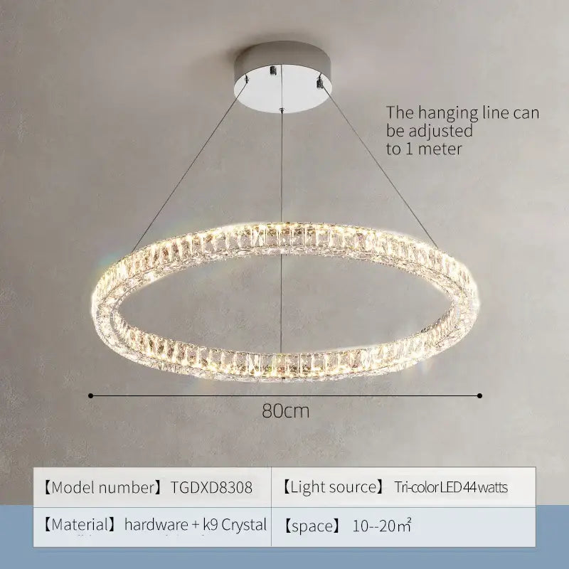 A modern decorbites crystal chandelier ring with chrome base and clear k9 crystals illuminated by tri-color led lights