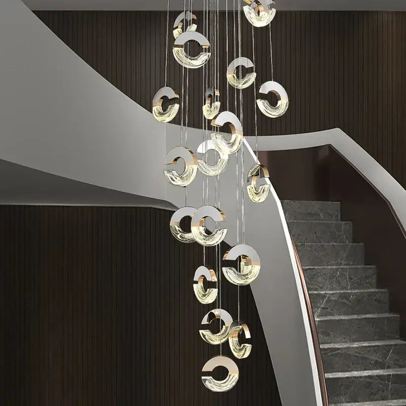 Modern gold-toned decorbites crystal chandelier ring pendant light with clear glass elements hanging from thin cables