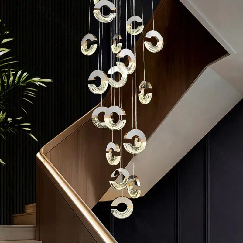 Modern decorbites crystal chandelier pendant light with circular translucent glass rings suspended by thin metallic chains