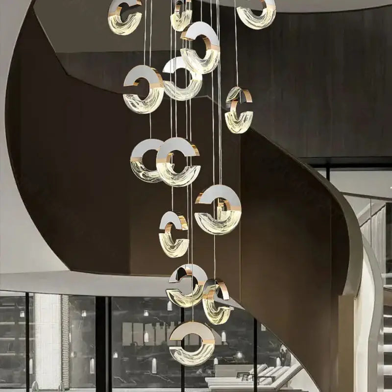 Modern minimalist decorbites crystal chandelier pendant light with cascading circular glass and gold-toned metal rings