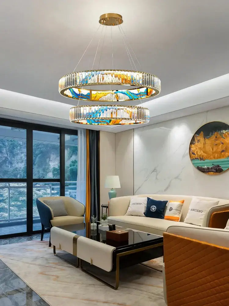 A modern decorbites crystal chandelier with gold metal frames and colorful stained glass panels for living rooms