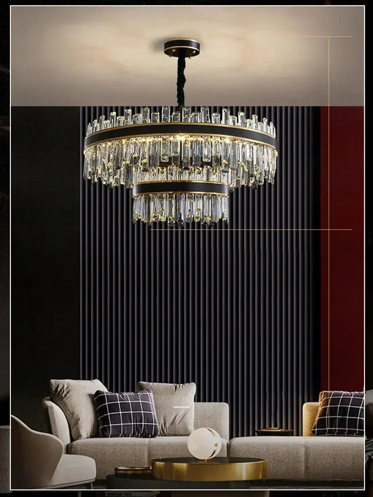 A modern two-tiered decorbites crystal chandelier with clear crystal prisms and gold-toned metal for luxury living rooms