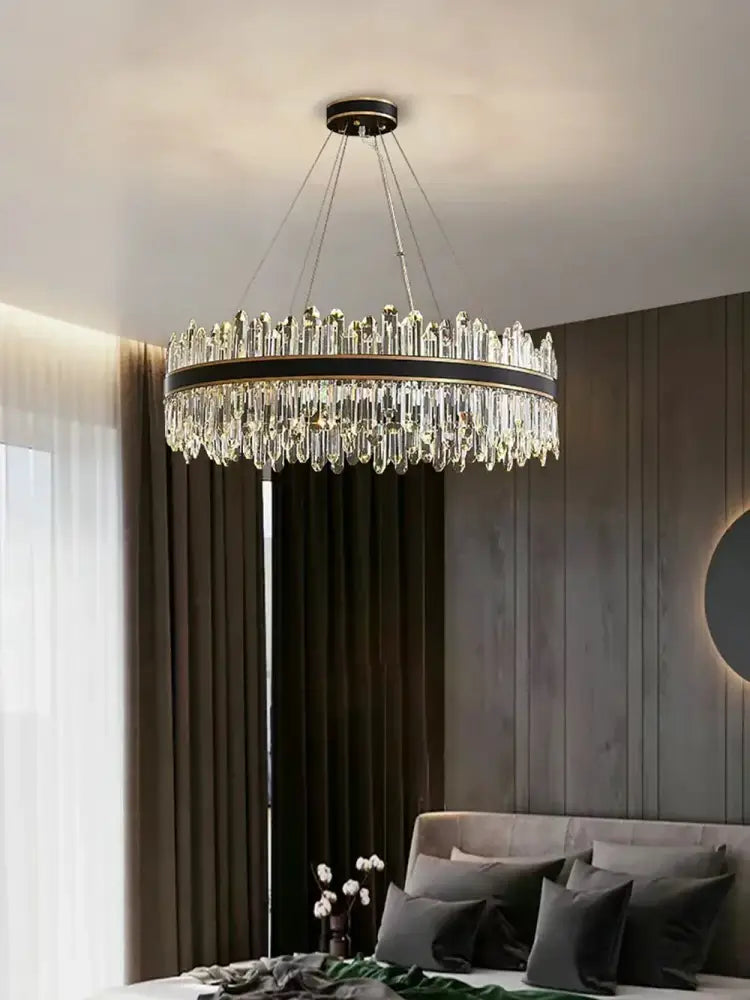A modern decorbites crystal chandelier with black metal frame and cascading clear crystal prisms for luxury living room decor