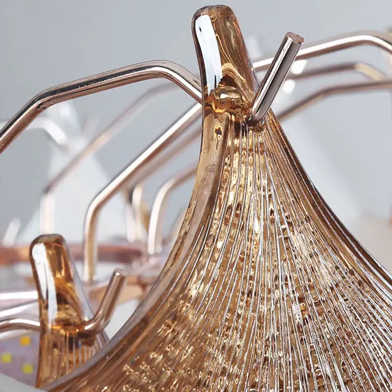 Decorbites crystal chandelier shell lamp features a golden textured glass wine rack with sleek metallic hooks for elegant display