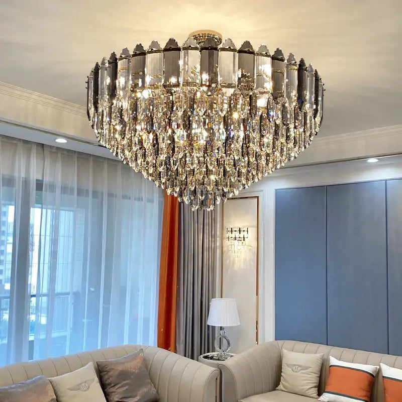 A decorbites crystal chandelier with gold-toned center and clear faceted crystals for luxury living room lighting