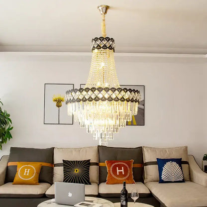 DecorBites crystal chandelier with gold-toned frame, cascading crystal prisms, and black diamond accents for spiral staircase