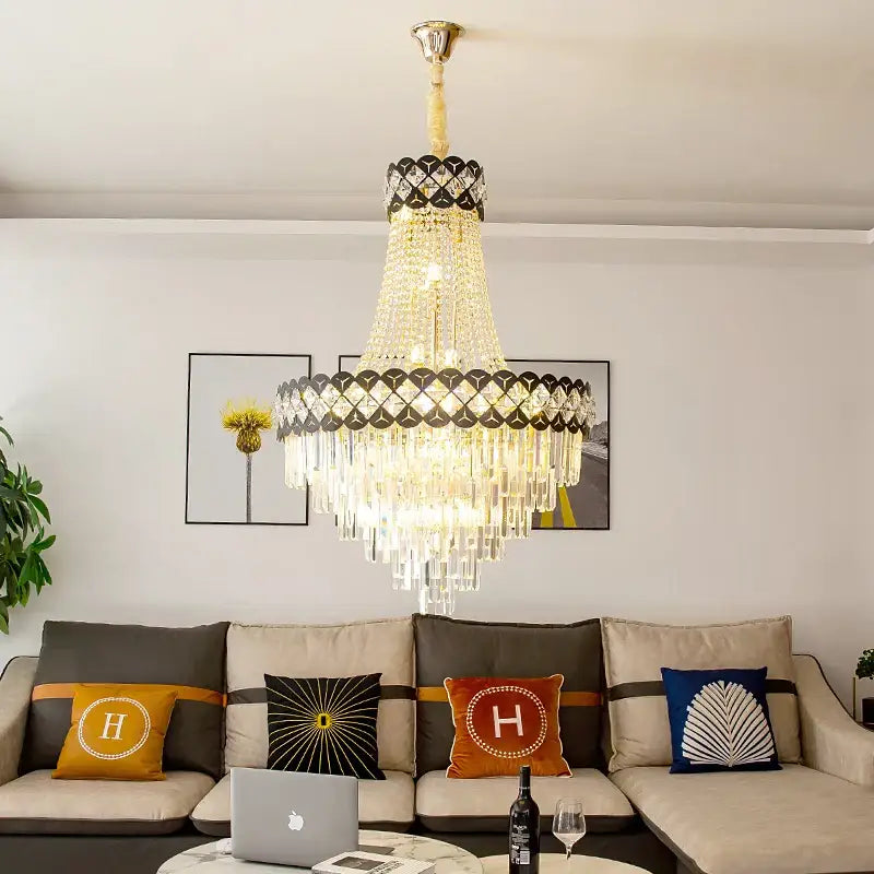 DecorBites crystal chandelier with gold-toned frame, cascading crystal prisms, and black diamond accents for spiral staircase