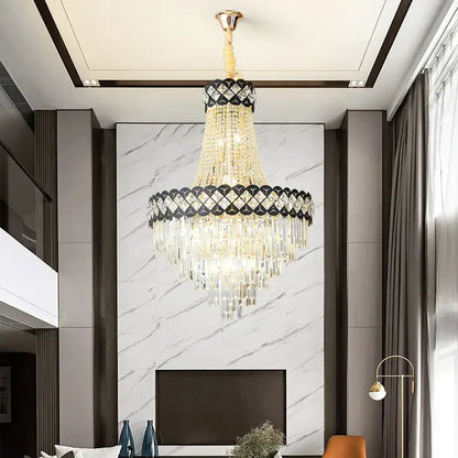 A decorbites crystal chandelier with gold tone, cascading crystal strands and black diamond patterned band for living rooms