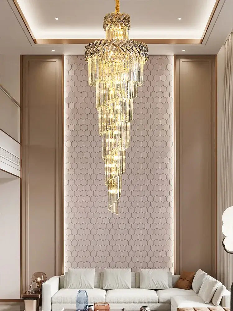 Decorbites crystal chandelier featuring a gold-toned frame with cascading tiers of faceted glass elements