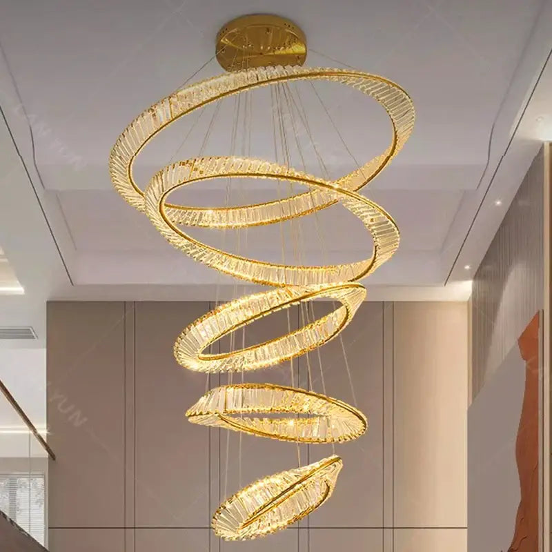 Decorbites crystal chandelier featuring a golden spiral design with crystal accents for stair and living room lighting