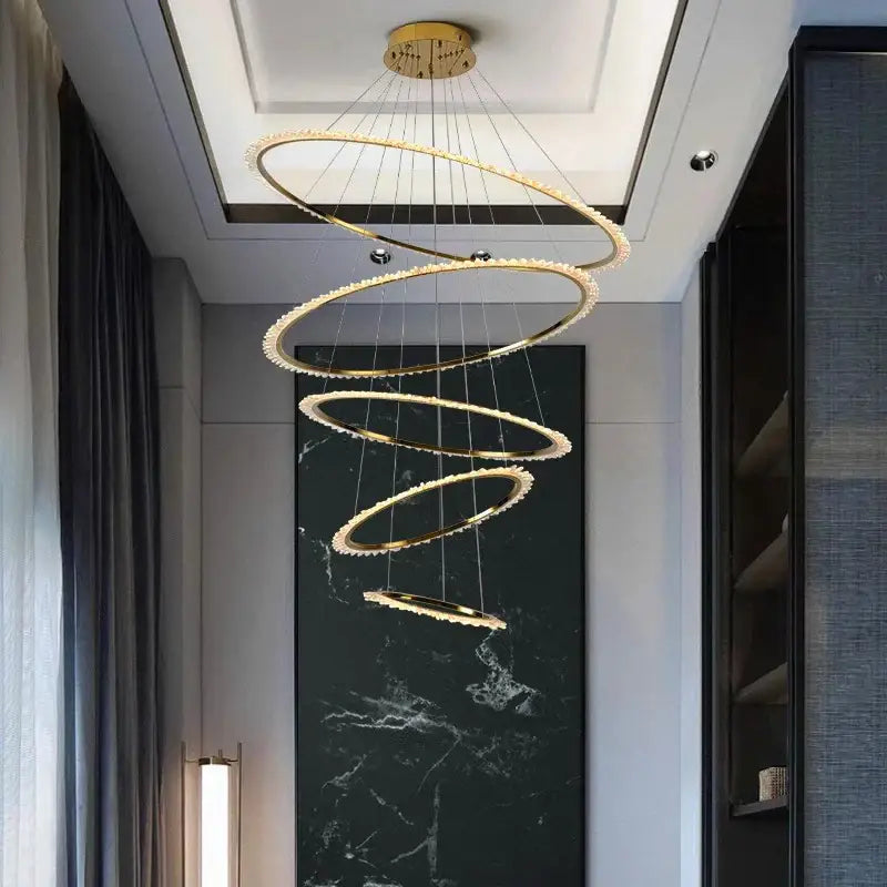 Golden spiral decorbites crystal chandelier with crystal accents hanging from ceiling mount for modern living room lighting