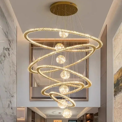 Golden spiral DecorBites crystal chandelier pendant lamp with crystal-encrusted rings and spherical lights for interiors