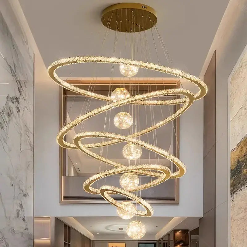 Golden spiral DecorBites crystal chandelier pendant lamp with crystal-encrusted rings and spherical lights for interiors