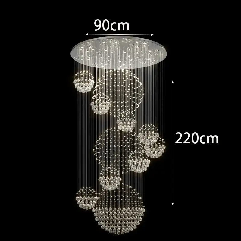 A modern decorbites crystal chandelier with clear crystal strands in tiered clusters for stair pendant lighting