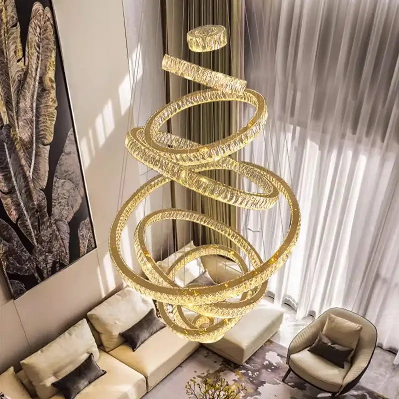 Golden spiral decorbites crystal chandelier with textured illuminated rings for modern living room lighting decor