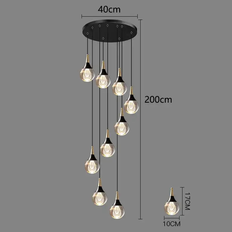 Modern black crystal chandelier stair pendant with seven gold-topped teardrop glass bulbs emitting warm light