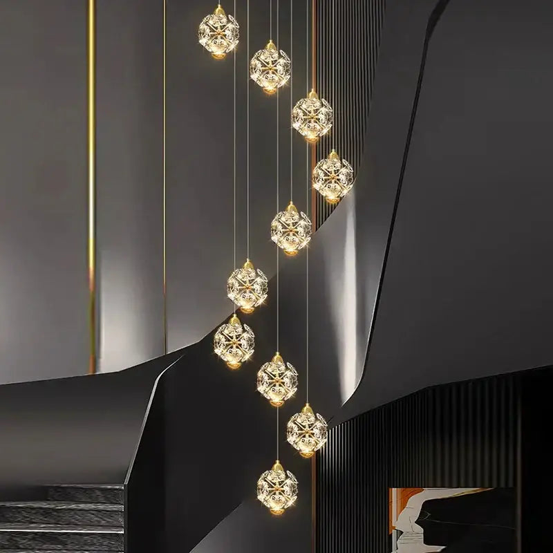 A modern decorbites crystal chandelier stair pendant lamp with gold-toned accents and cascading design for living rooms