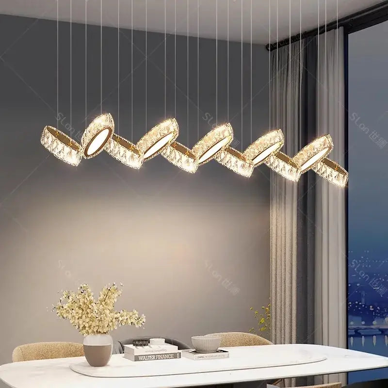 Gold-toned crystal-encrusted DecorBites crystal chandelier stair pendant with a modern zigzag design for living room lighting