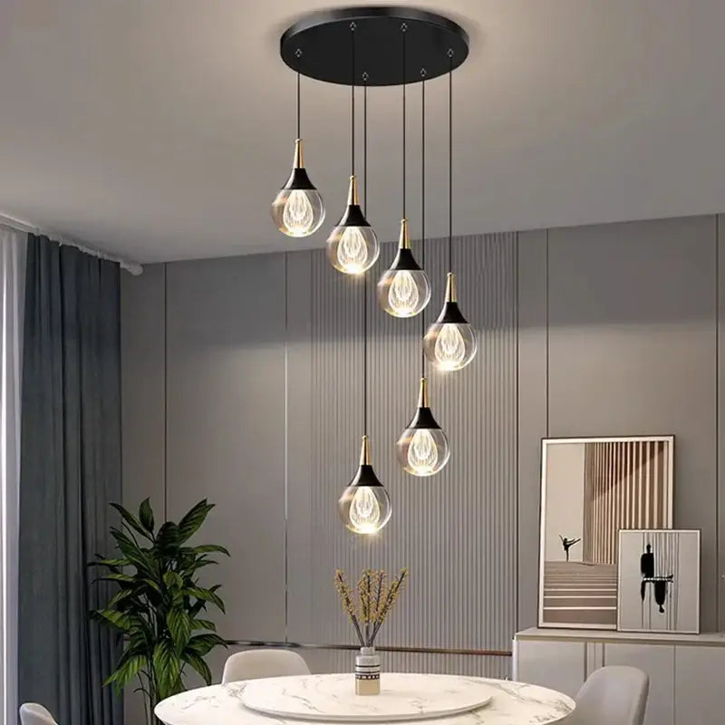 Modern black circular stair pendant lamp with five glass crystal chandelier stair lights and gold-toned accents