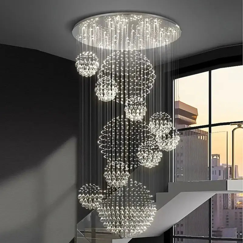 A modern decorbites crystal chandelier stair pendant with clear crystal beads and bright sparkling light for living rooms