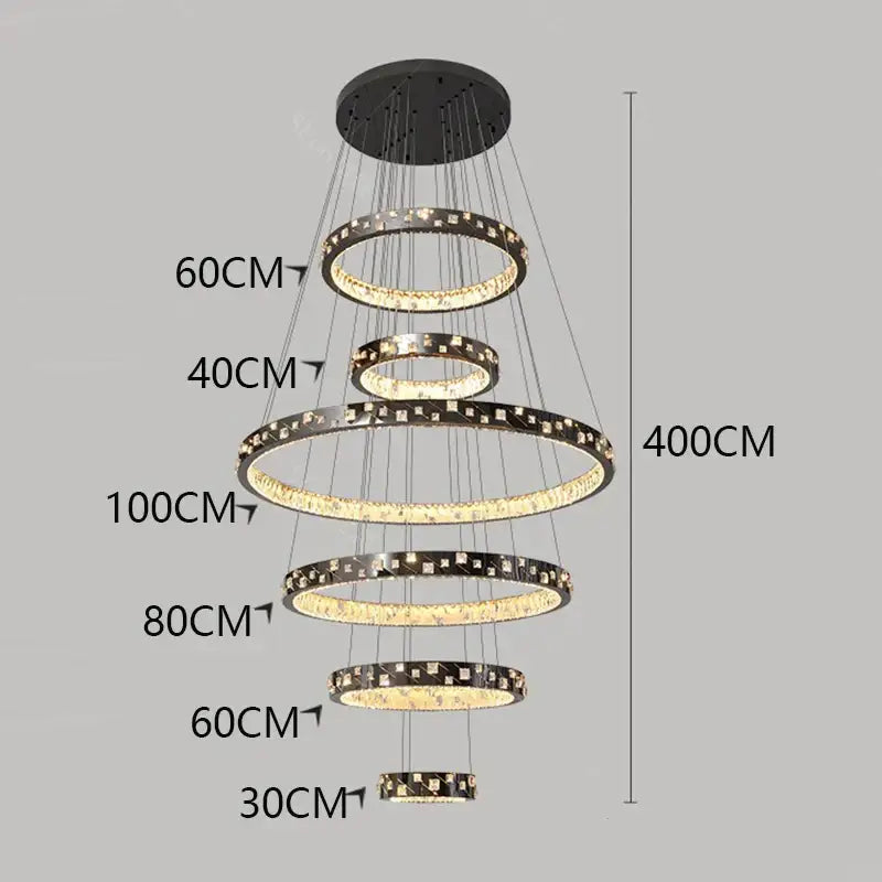 Modern black and gold DecorBites crystal chandelier stair pendant with concentric rings and illuminated crystal accents