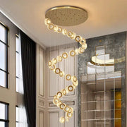 Golden spiral decorbites crystal chandelier with crystal rings and circular ceiling mount for stair pendant lighting