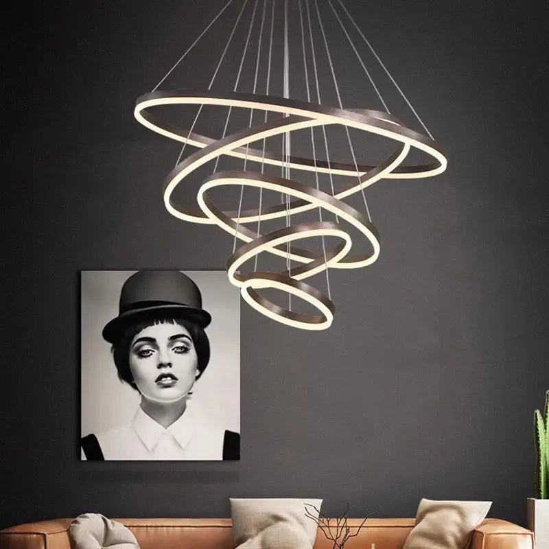 Modern decorbites crystal chandelier stair pendant lamp with glowing spiral rings suspended by thin cords for interior lighting