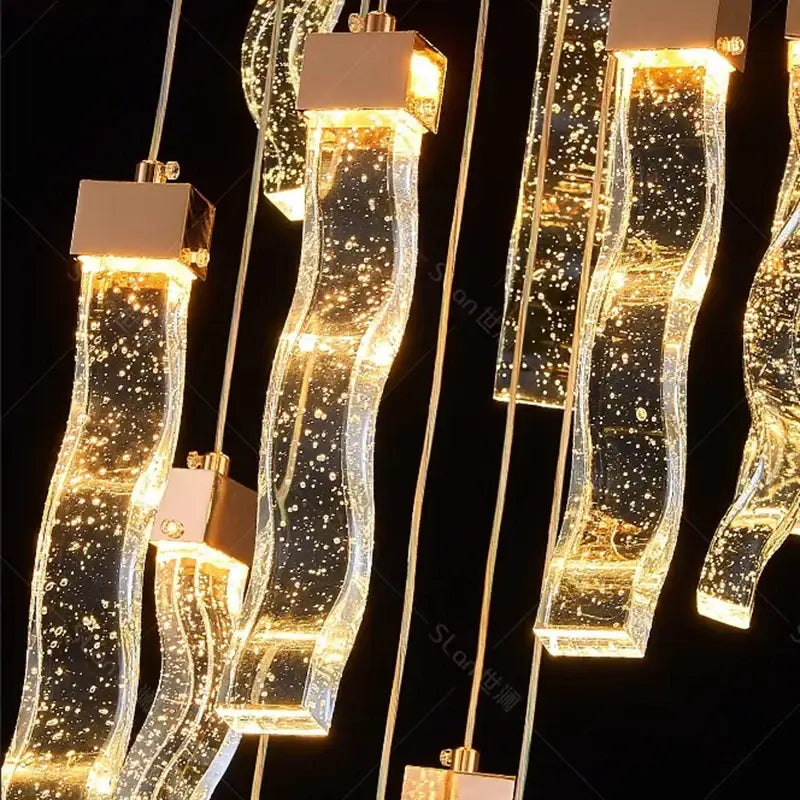 Modern gold-accented decorbites crystal chandelier pendant lamp with glowing glass arms for living room lighting
