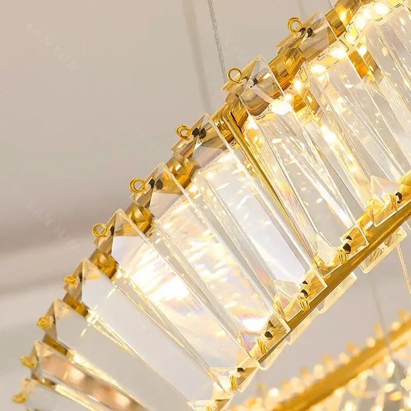 Gold-toned decorbites crystal chandelier with faceted clear crystal panels for living room pendant lighting