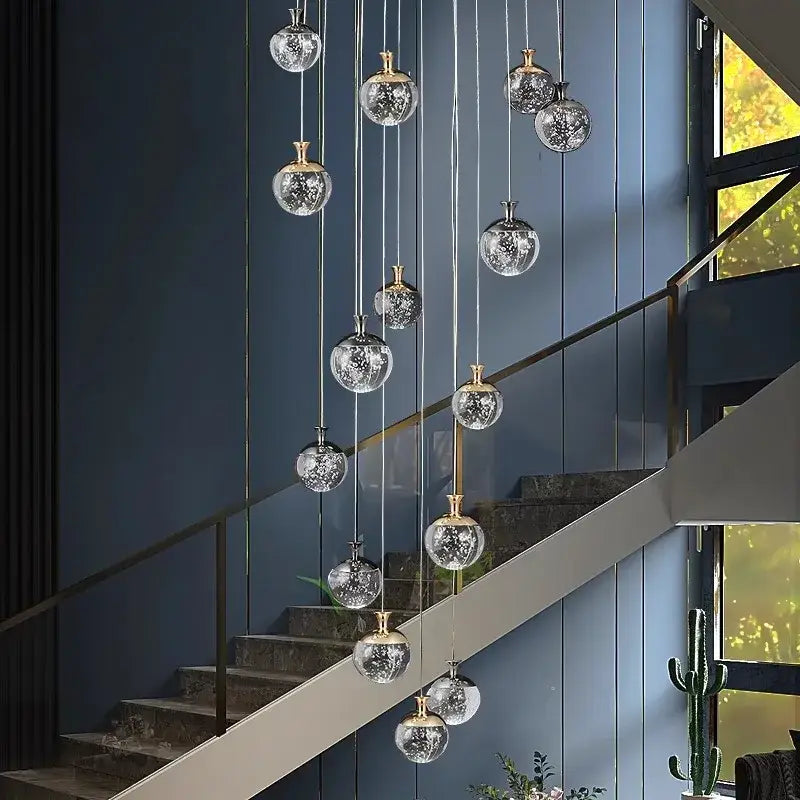 DecorBites crystal chandelier stair pendant with multiple crackled frosted glass orbs and gold-toned fixtures