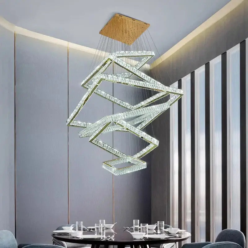 A modern decorbites crystal chandelier with interlocking crystal rings and wooden ceiling mount for stair lighting