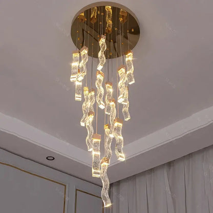 A modern gold-toned decorbites crystal chandelier pendant lamp with cascading glass elements for living room lighting
