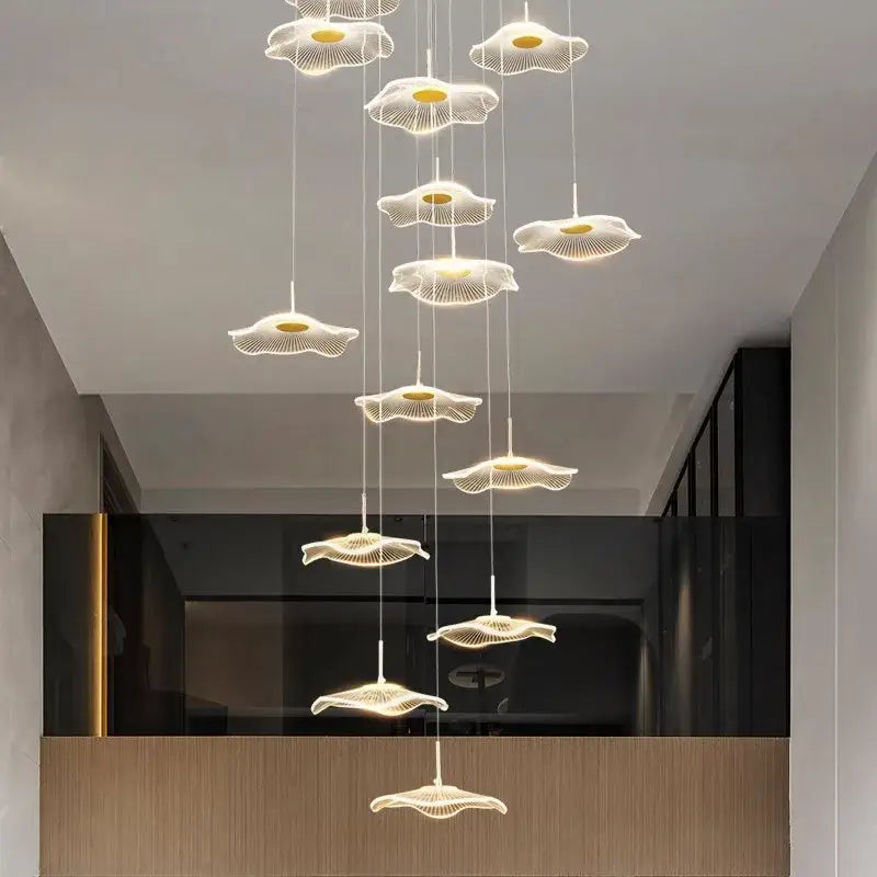 A modern white DecorBites crystal chandelier pendant light with delicate petal-shaped LED lights for stair lighting