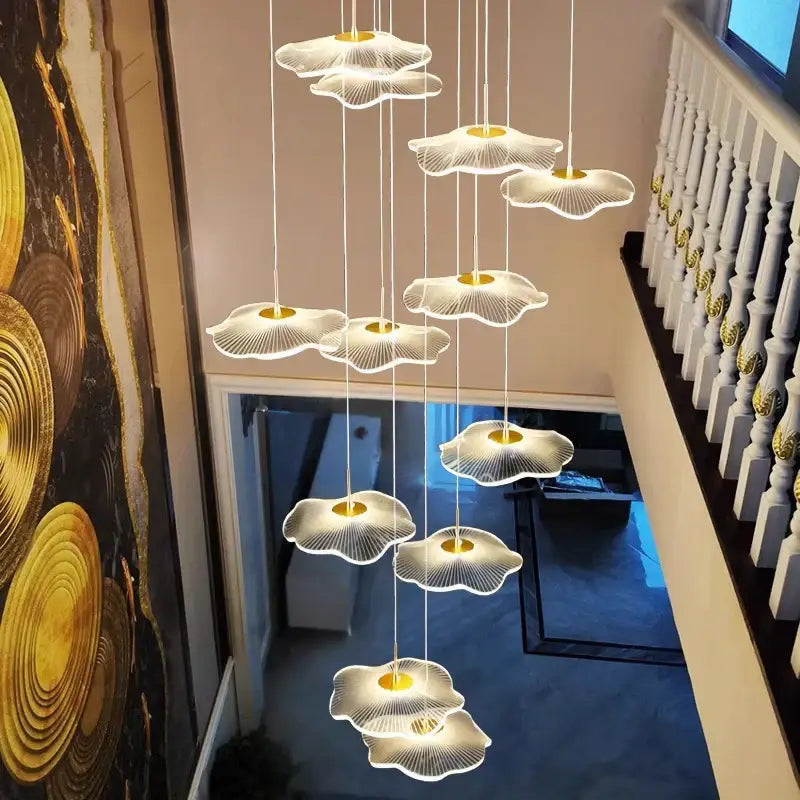 A modern DecorBites crystal chandelier stair pendant light with white petal shades and golden centers for living rooms