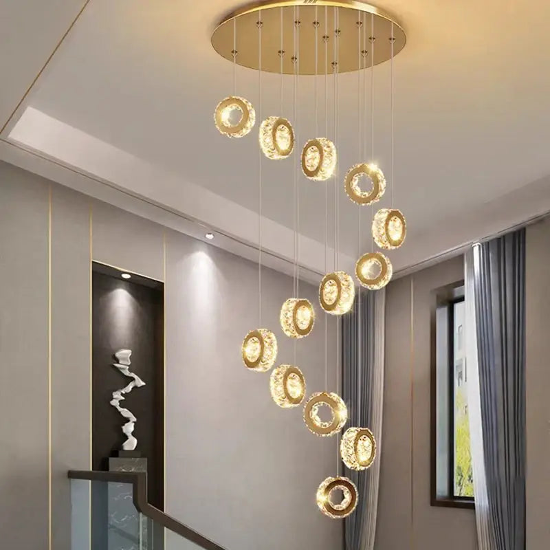 Golden circular decorbites crystal chandelier with crystal-encrusted rings for stair pendant interior lighting