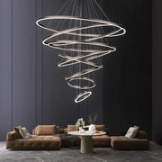 Modern spiral decorbites crystal chandelier pendant lamp with metallic finish and illuminated rings for stair lighting