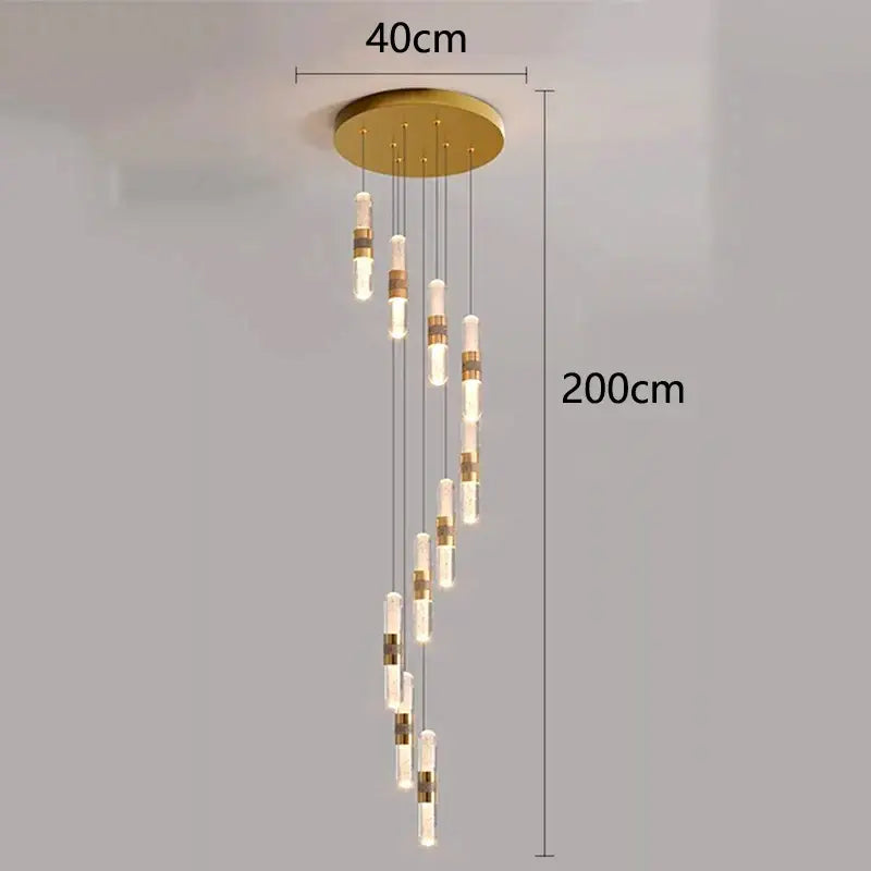Gold-toned decorbites crystal chandelier pendant lamp with cascading cylindrical glass and brass accents for stair lighting