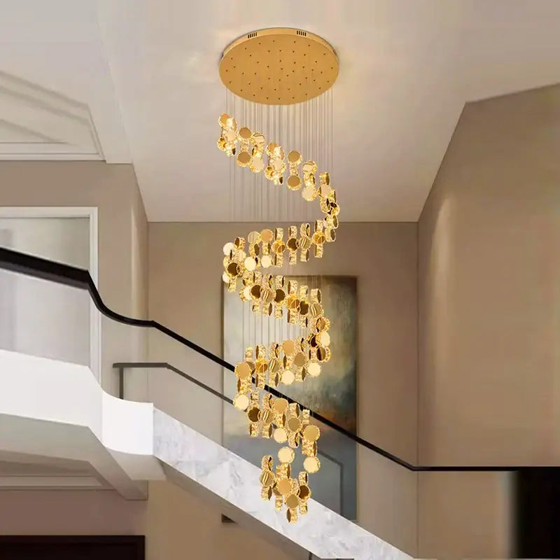 Decorbites crystal chandelier with golden spiral and mirrored discs suspended from round ceiling fixture for stair pendant lighting