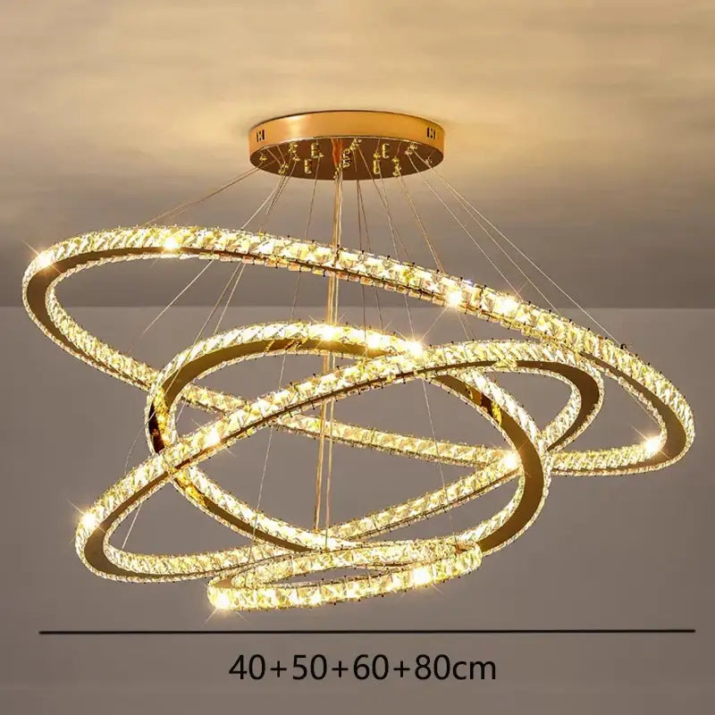 Golden decorbites crystal chandelier stair pendant light with interlocking crystal hoops emitting warm light