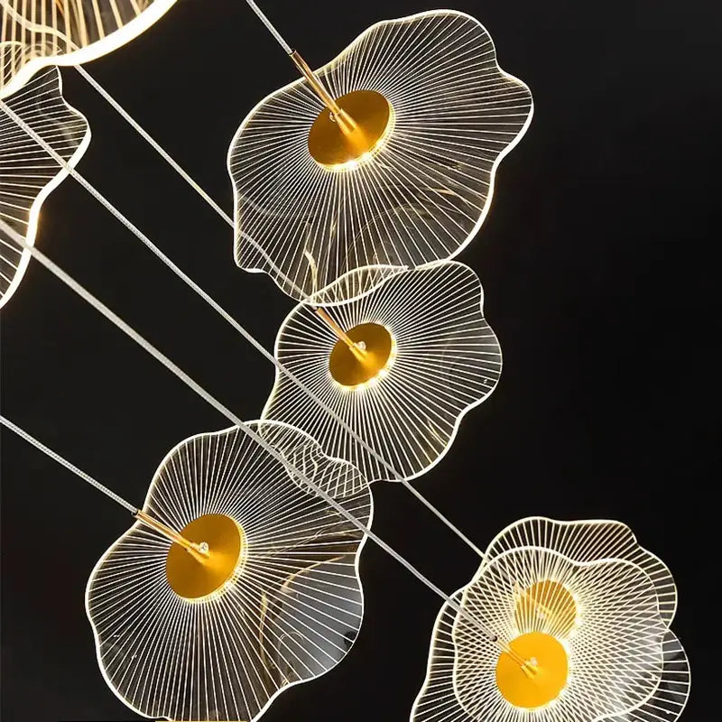 Modern gold-toned decorbites crystal chandelier stair pendant light with translucent petal frames and glowing illumination